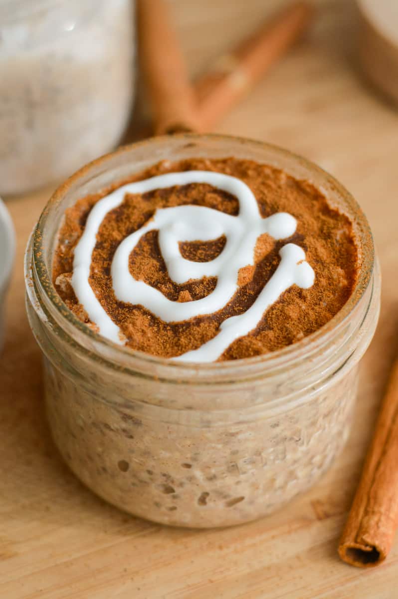 Close up of cinnamon roll overnight oats with a Greek yogurt icing topping.