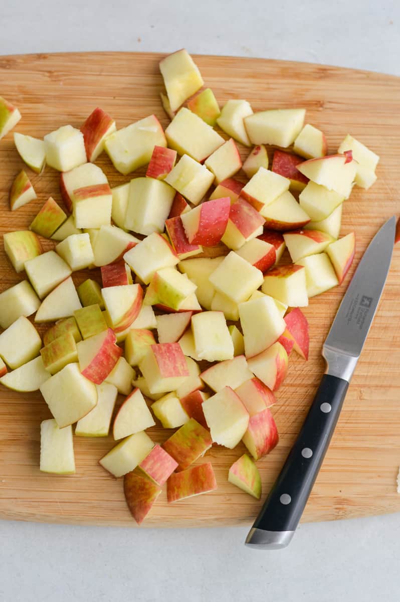 Dicing apples into cubes.