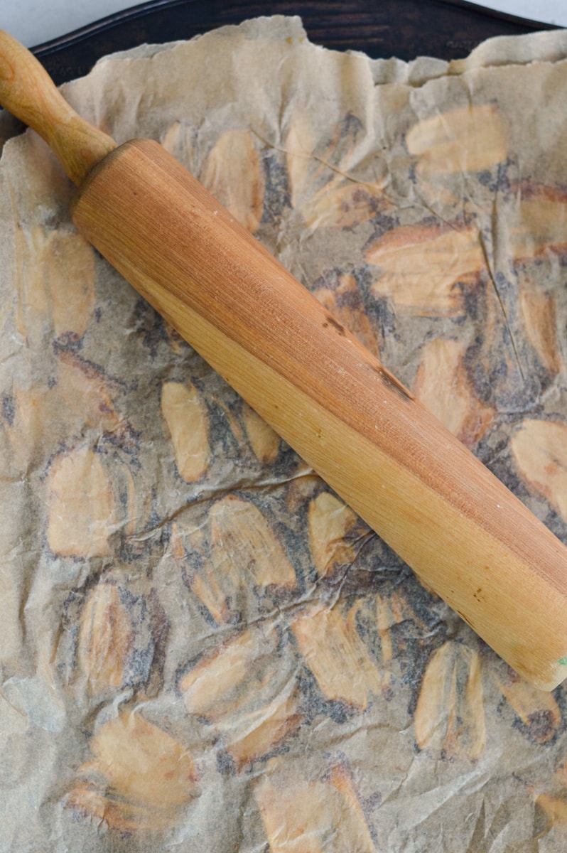 Flattening dates with a rolling pin.