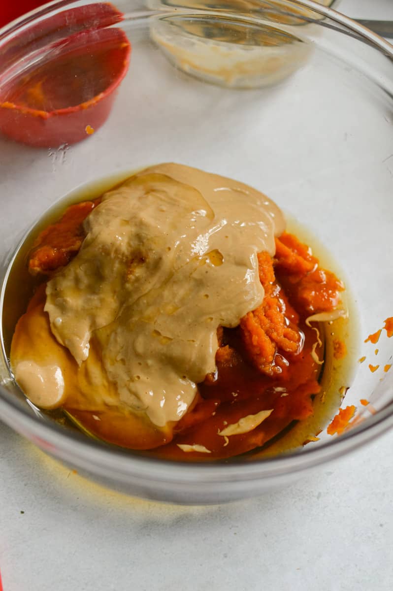 Combining pumpkin puree, cashew butter and maple syrup.
