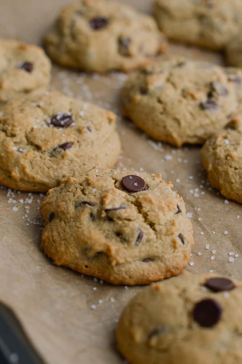 Sprinkling chocolate chip oat flour cookies with flakey sea salt.
