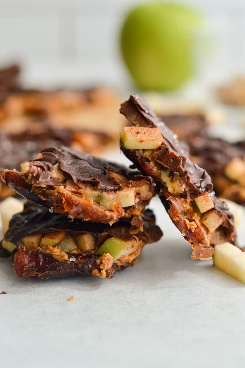 Stacked pieces of caramel apple chocolate date bar.