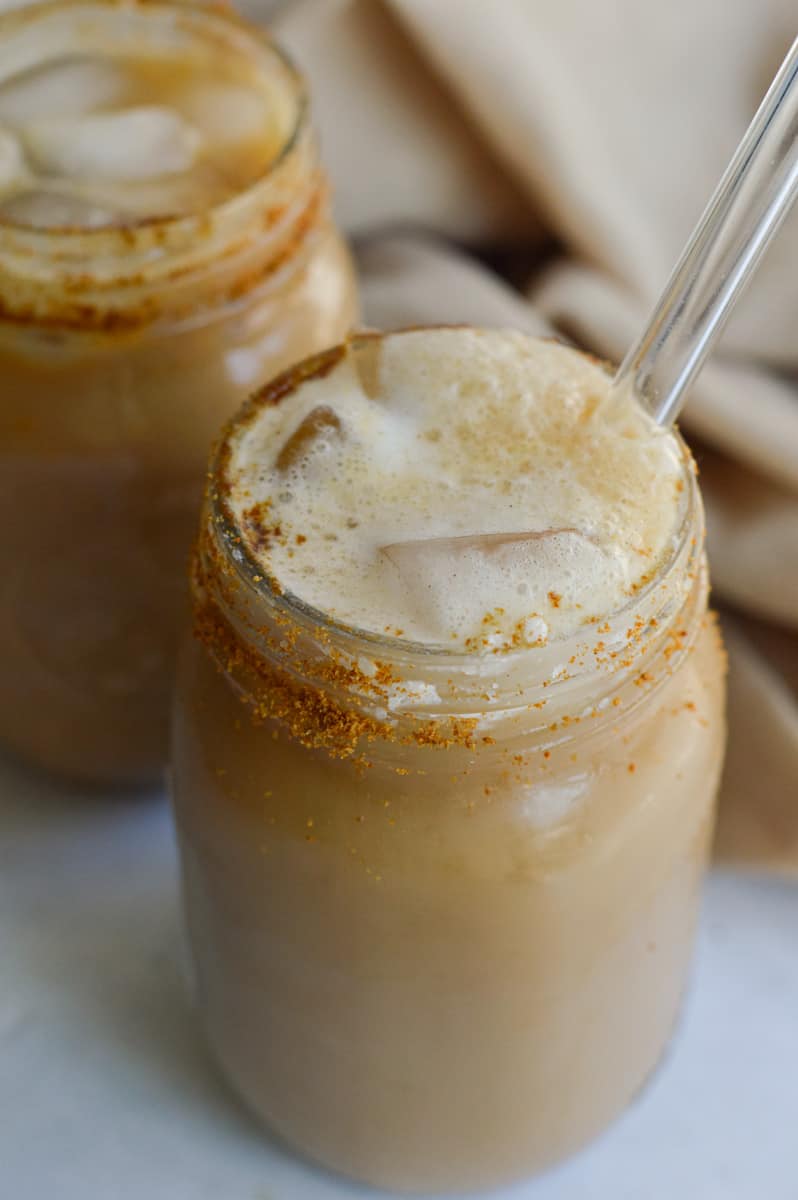 Glass of cold brew with pumpkin cold foam.