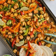 Sheet pan tofu fajitas with tortillas.