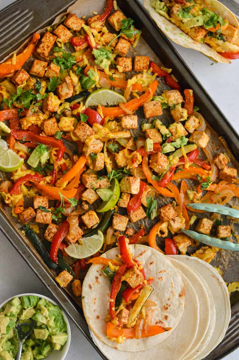 Sheet pan tofu fajitas with tortillas.