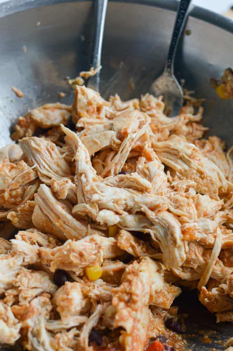 Shredding slow cooker chicken.