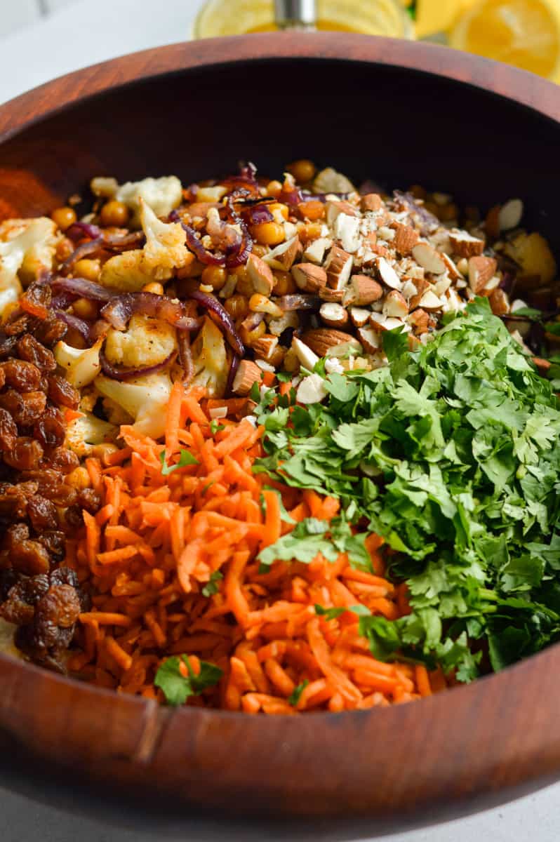 Combining couscous salad ingredients. 