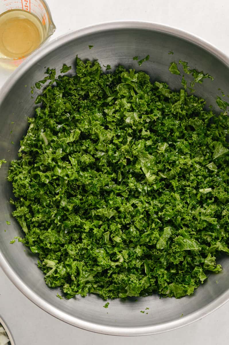 Massaging kale with olive oil.