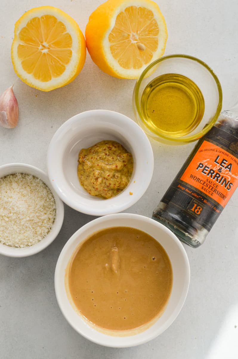 Ingredients including mustard, parmesan, tahini, worchestershire, lemon  and garlic.