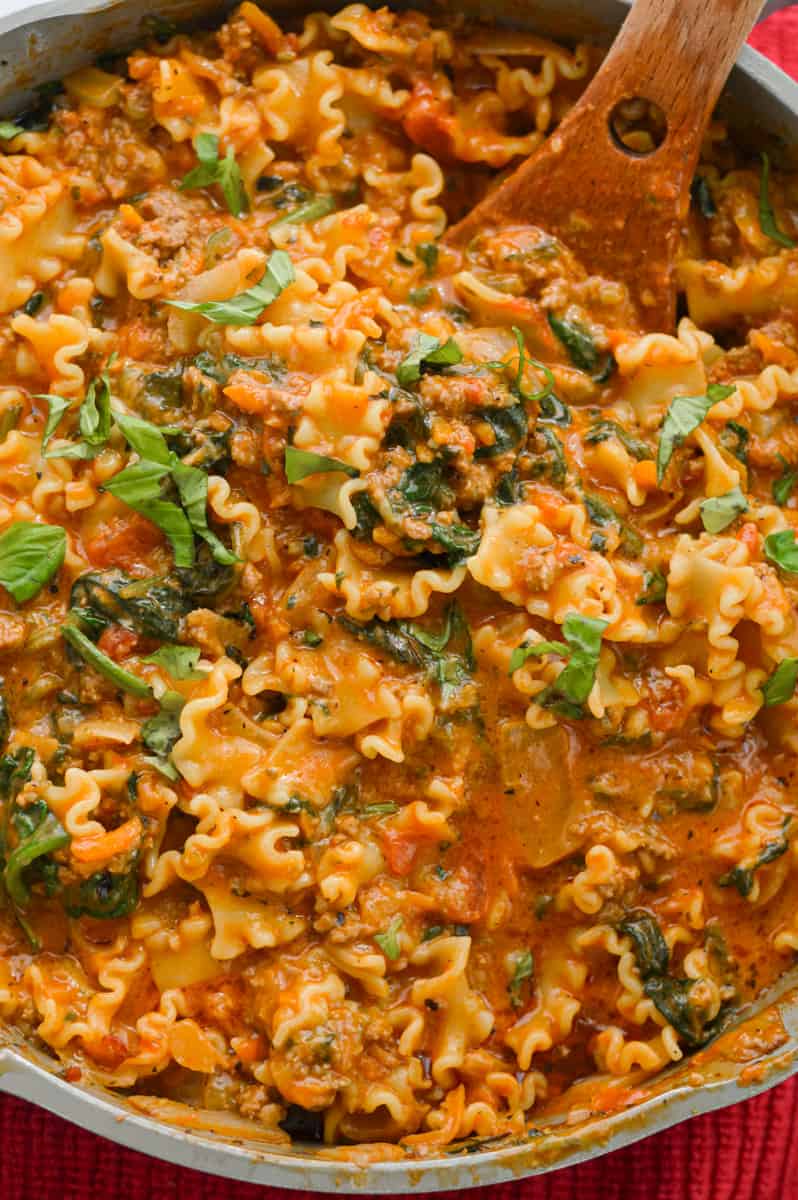 Pan of hamburger helper lasagna, topped with parsley.