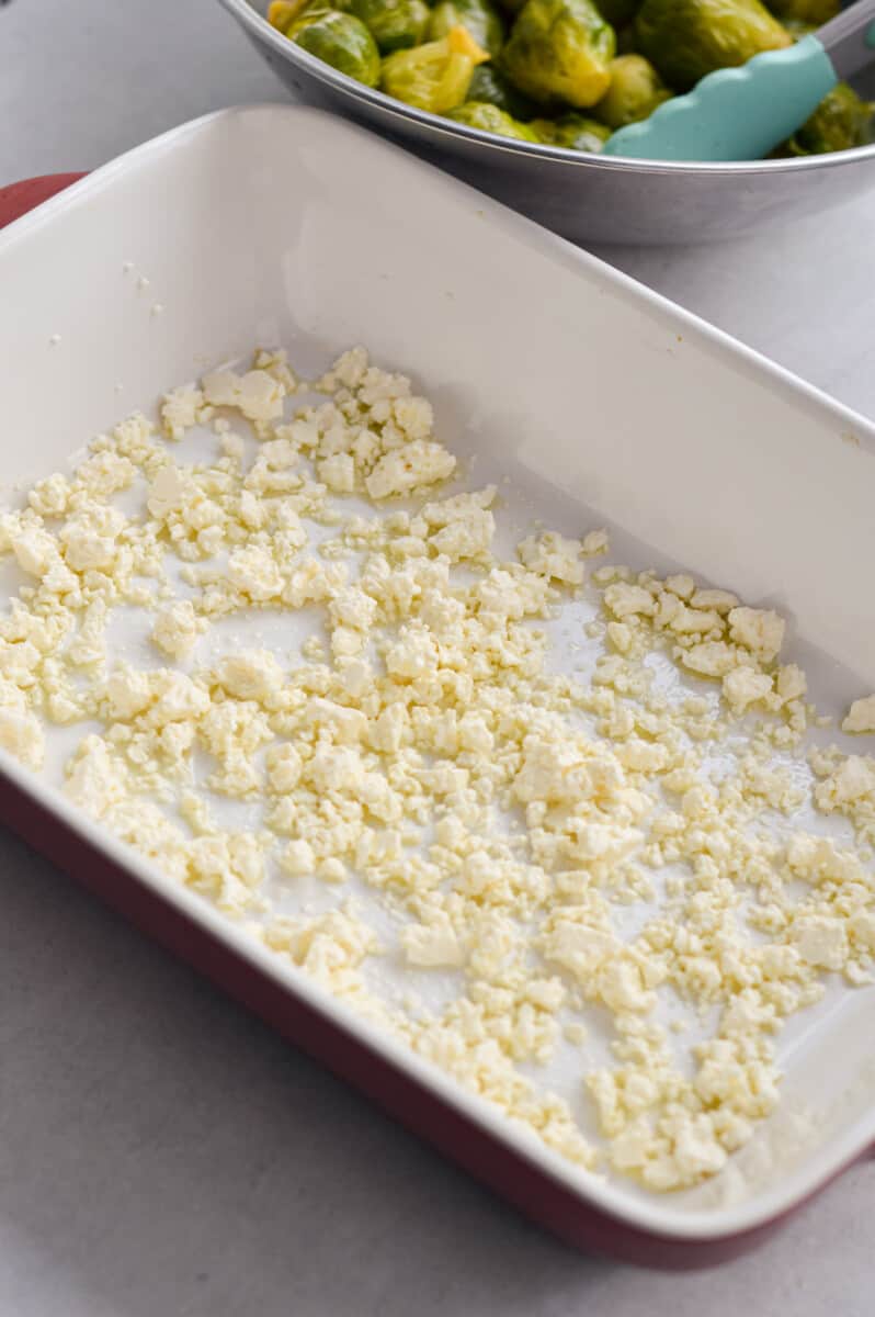 Baking tray coated with olive oil and feta cheese.