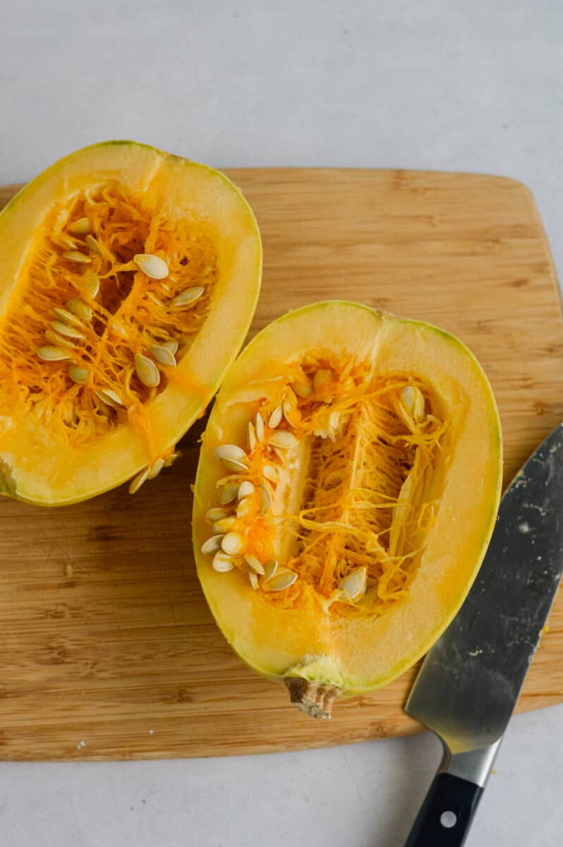 Cutting spaghetti squash in half.