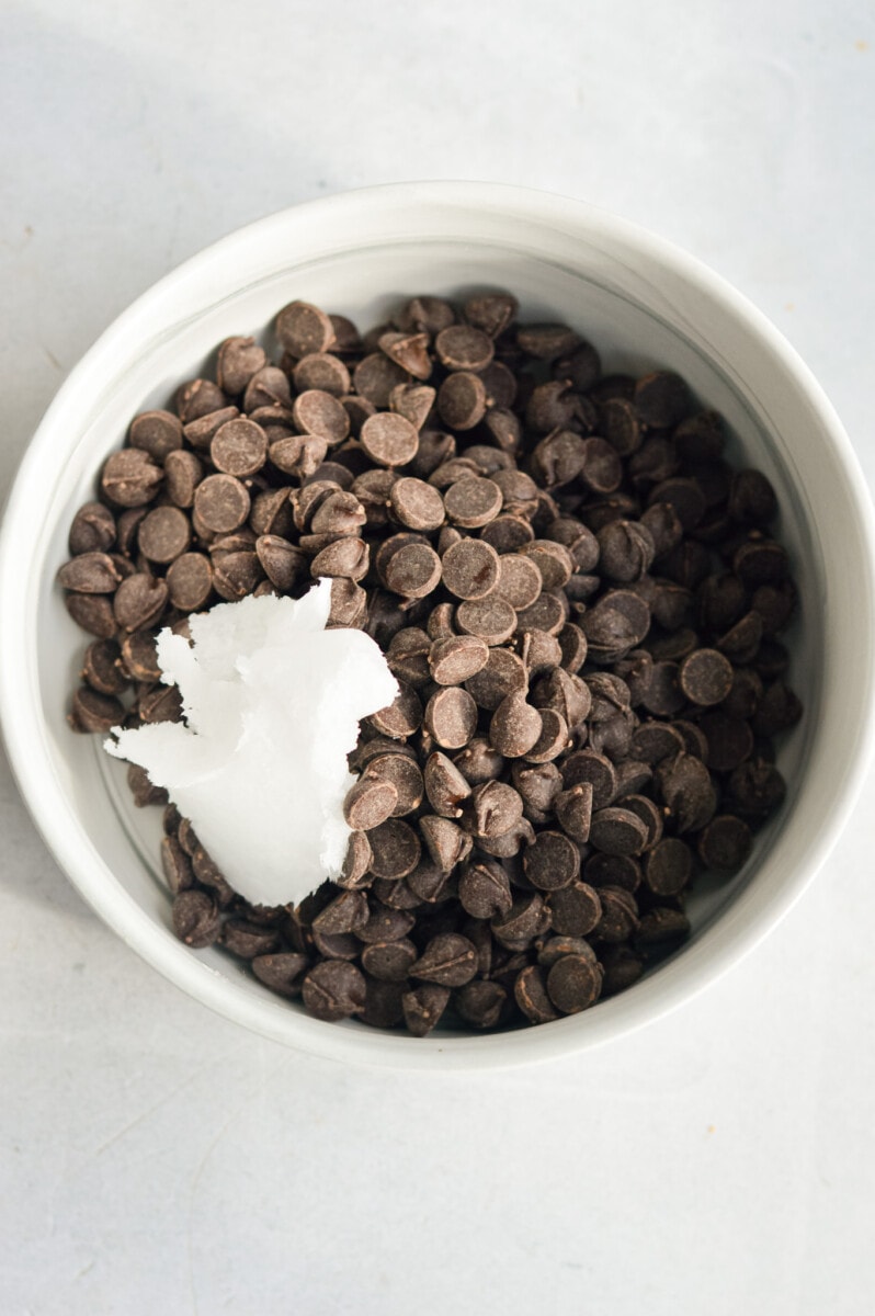 Melting dark chocolate and coconut oil.