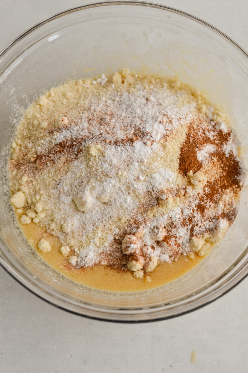 Mixing in almond flour, baking soda, cinnamon and salt.