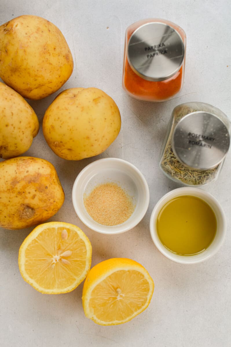 Ingredients including potatoes, olive oil, spices, parmesan and lemon.