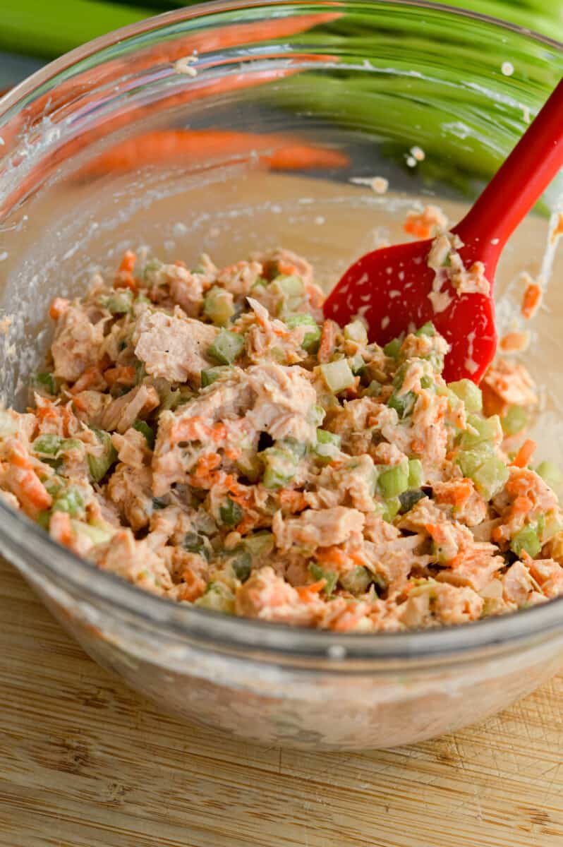 Mixing spicy tuna salad.