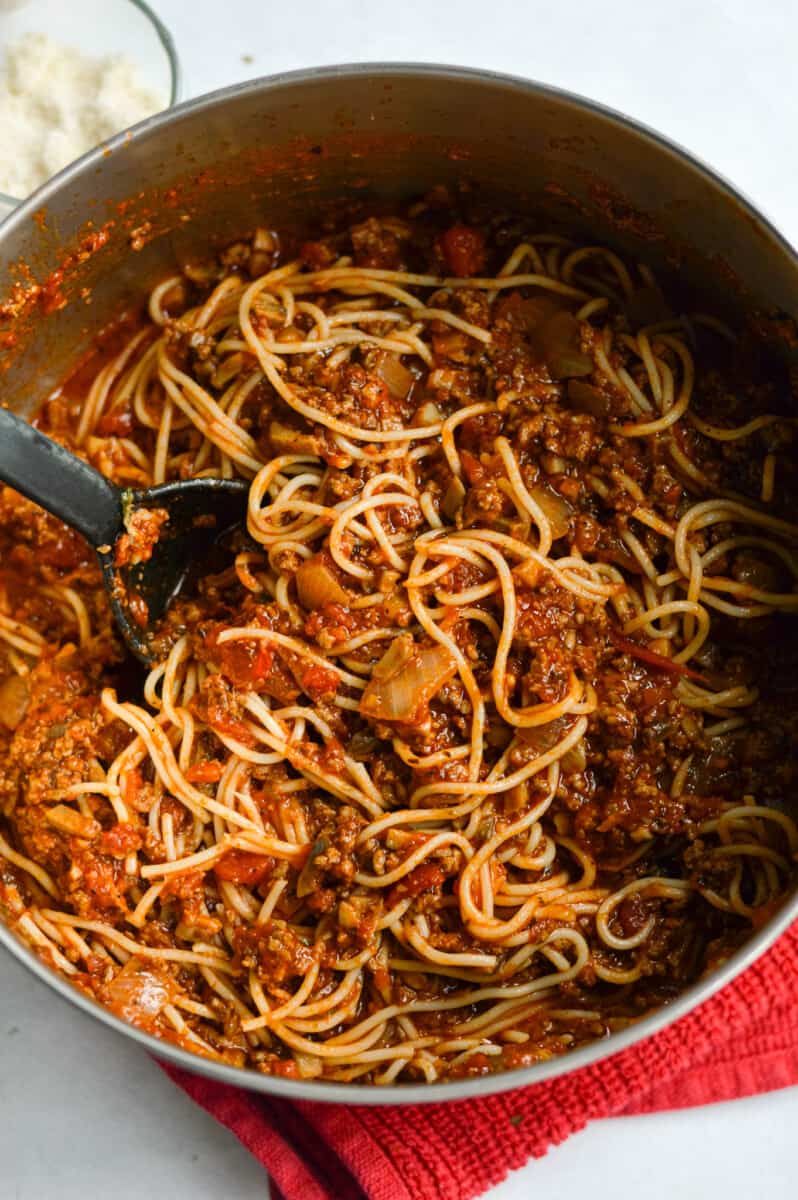 Pot of mushroom spaghetti sauce with ground beef.