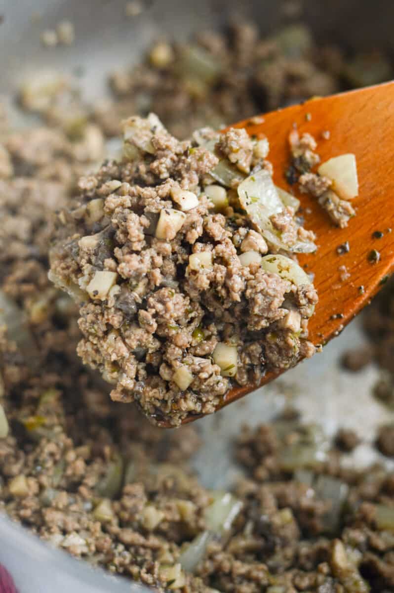 Cooking ground beef with garlic and onions.
