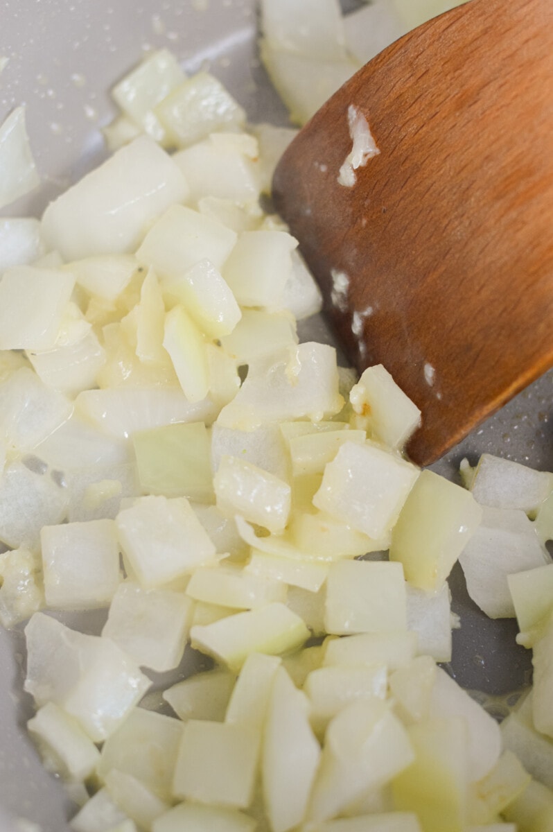 Sauteeing onions and garlic in butter.