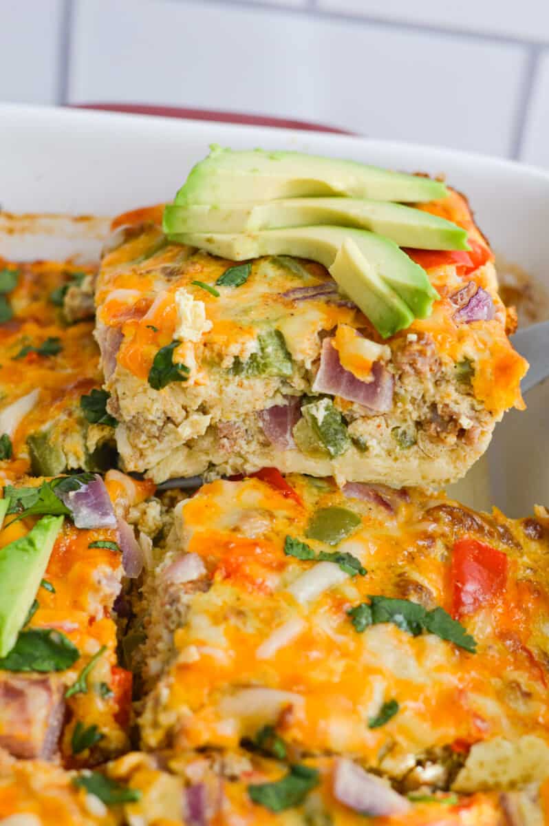LIfting up a slice of egg breakfast casserole.