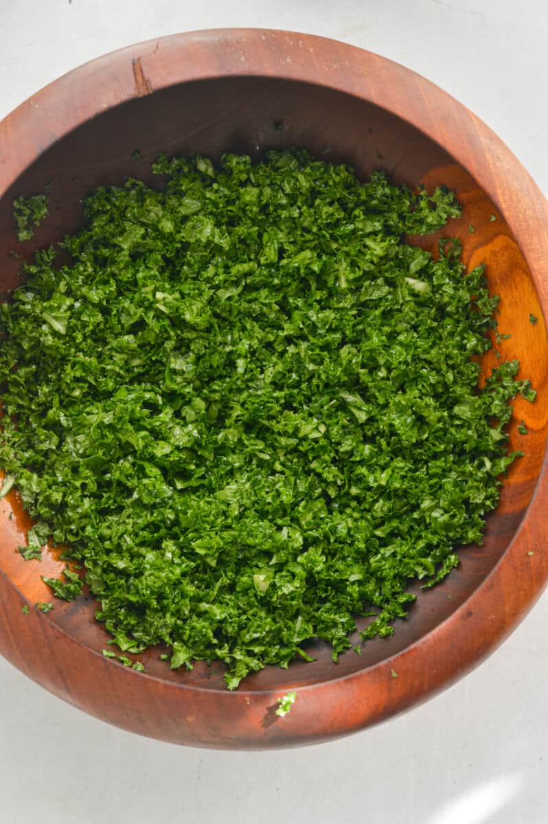 Massaging kale with olive oil.