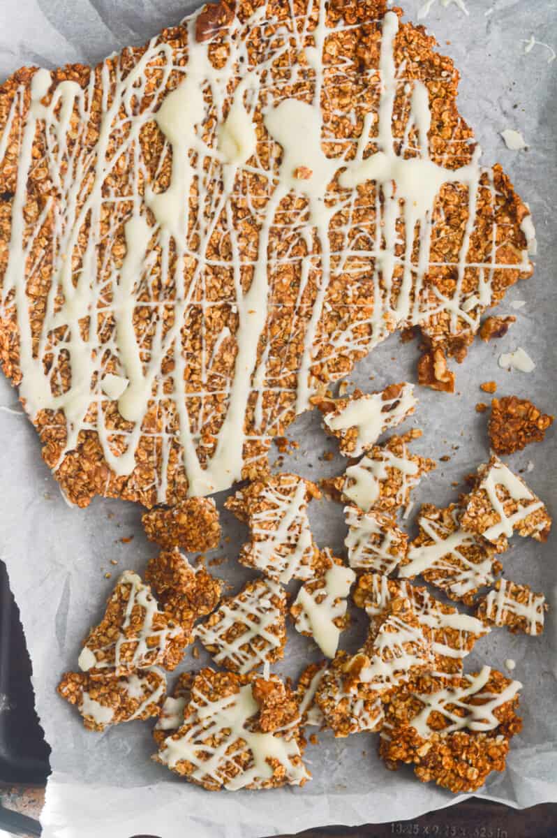 Breaking cinnamon roll granola into chunks.