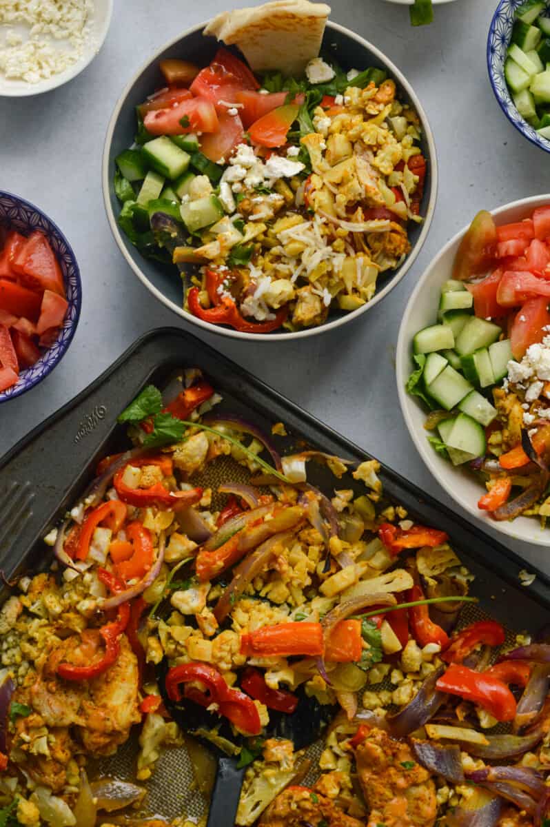 Assembling chicken shawarma bowls.