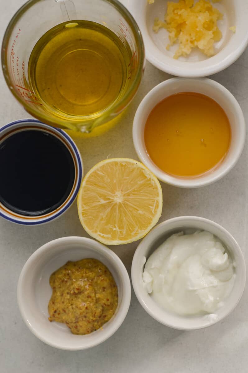 Ingredients including balsamic vinegar, lemon juice, greek yogurt, olive oil, dijon mustard and honey.