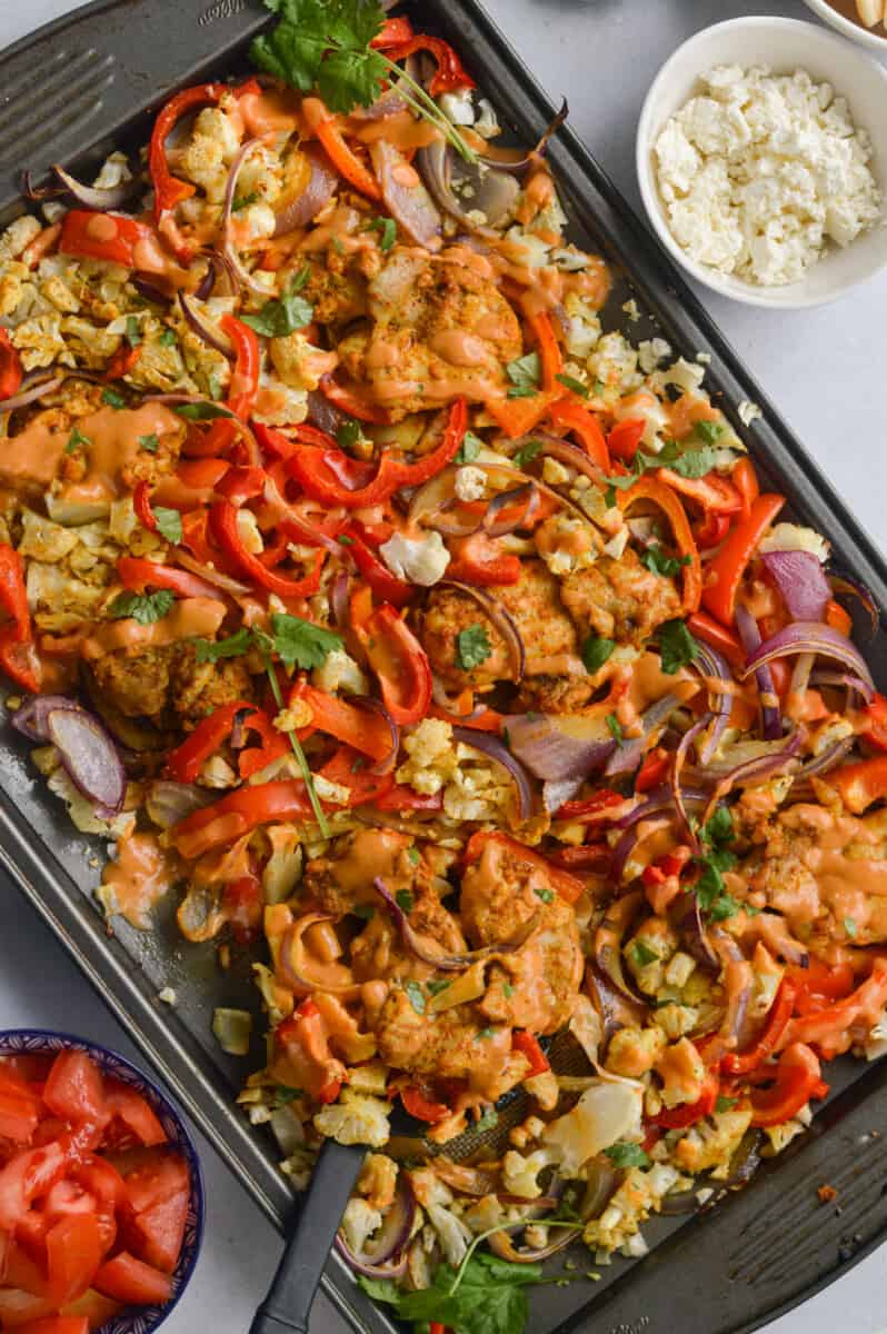 Sheet pan chicken shawarma with vegetables.