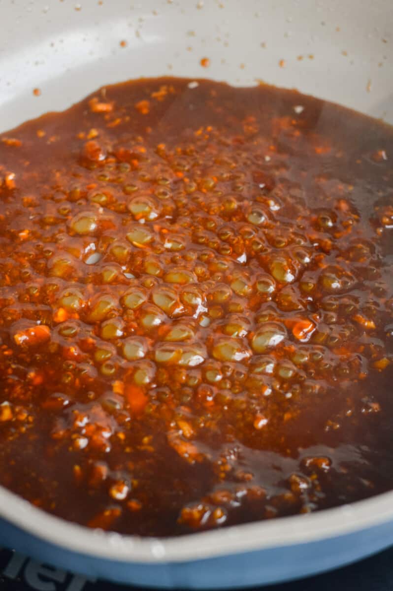 Cooking honey ginger garlic sauce.
