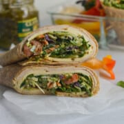 Cross section of a chicken spinach wrap with pesto.