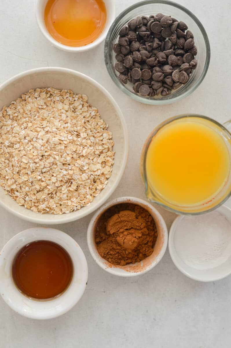 Ingredients including oats, orange juice, cocoa powder, chocolate chips, maple syrup, and salt.