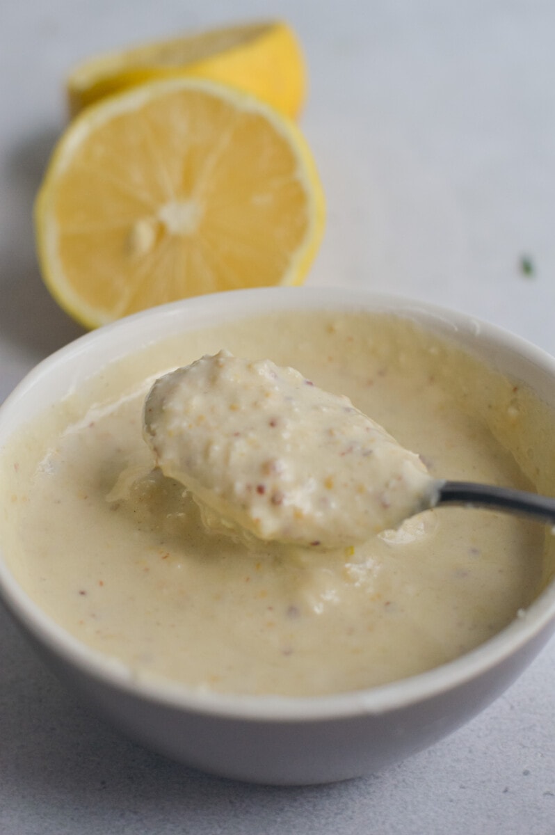 Bowl of creamy Greek yogurt Caesar dressing.