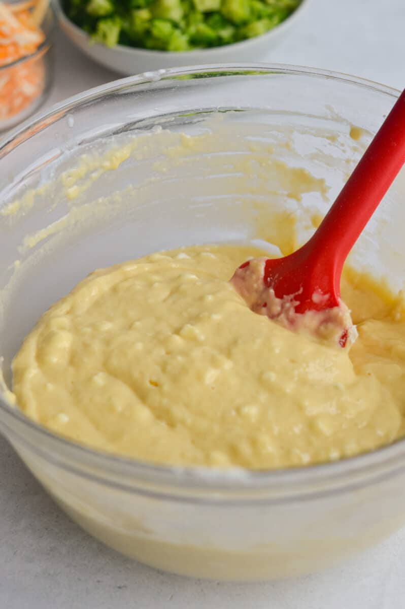 Whisking flour, baking powder and salt into savory muffin batter.