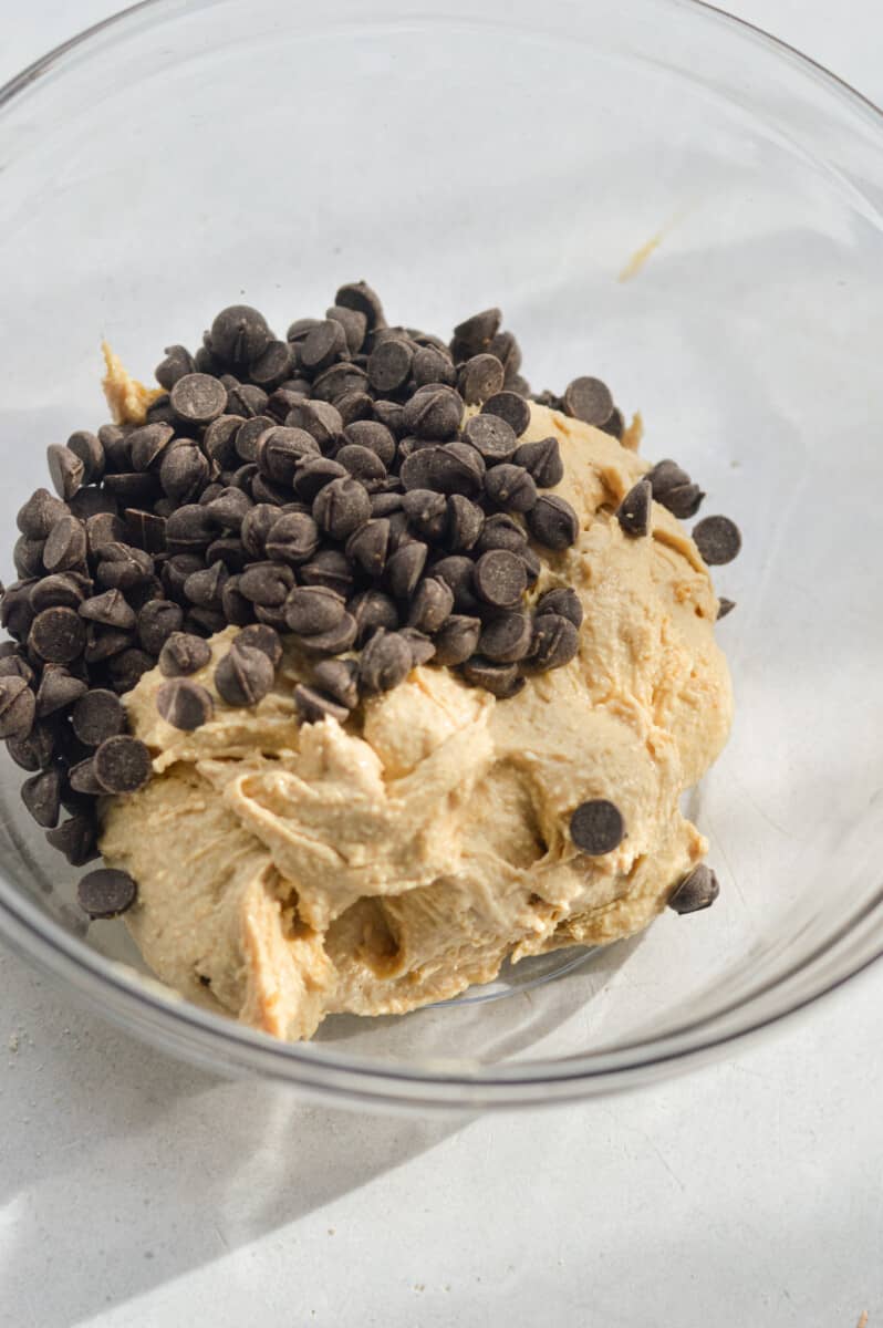 Mixing cottage cheese, protein powder, oat flour and chocolate chips.