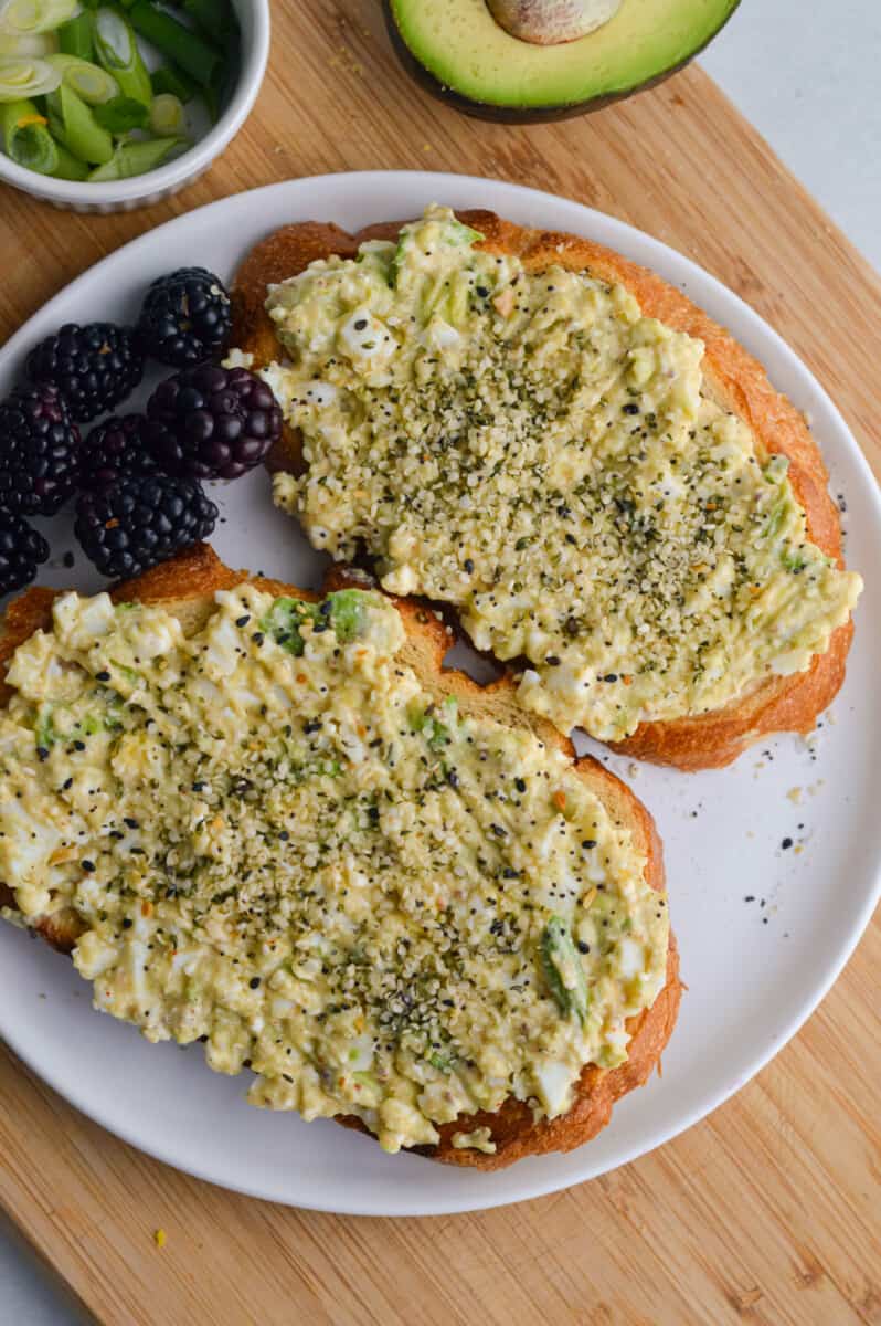 Birds eye of avocado cottage cheese toast with blackberries.