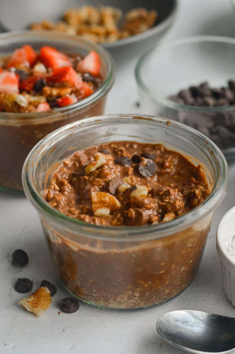 Close up of brownie batter chocolate overnight oats with chocolate chips.