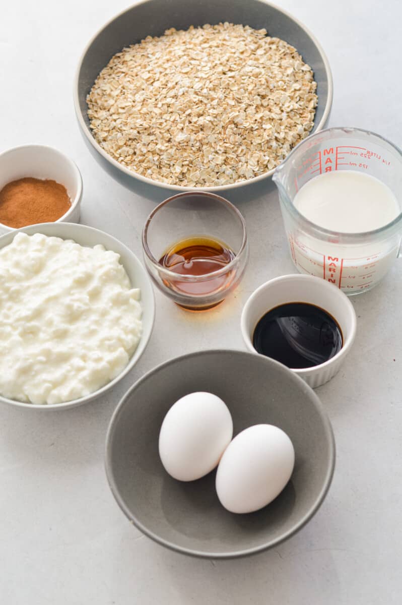 Ingredients including oats, milk, maple syrup, vanilla, eggs, cottage cheese and cinnamon.