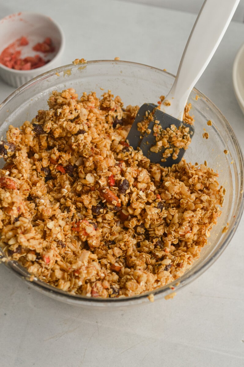 Stirring granola bar mixture.