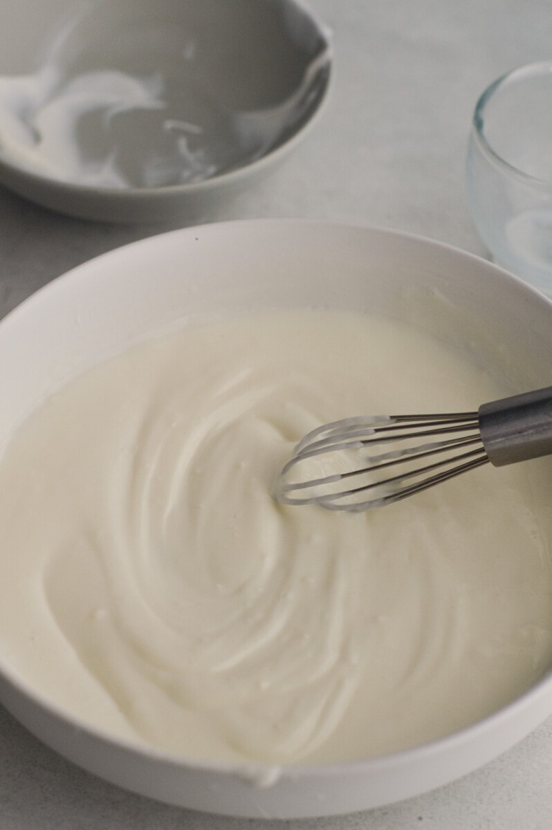 Whisking together Greek yogurt coating.
