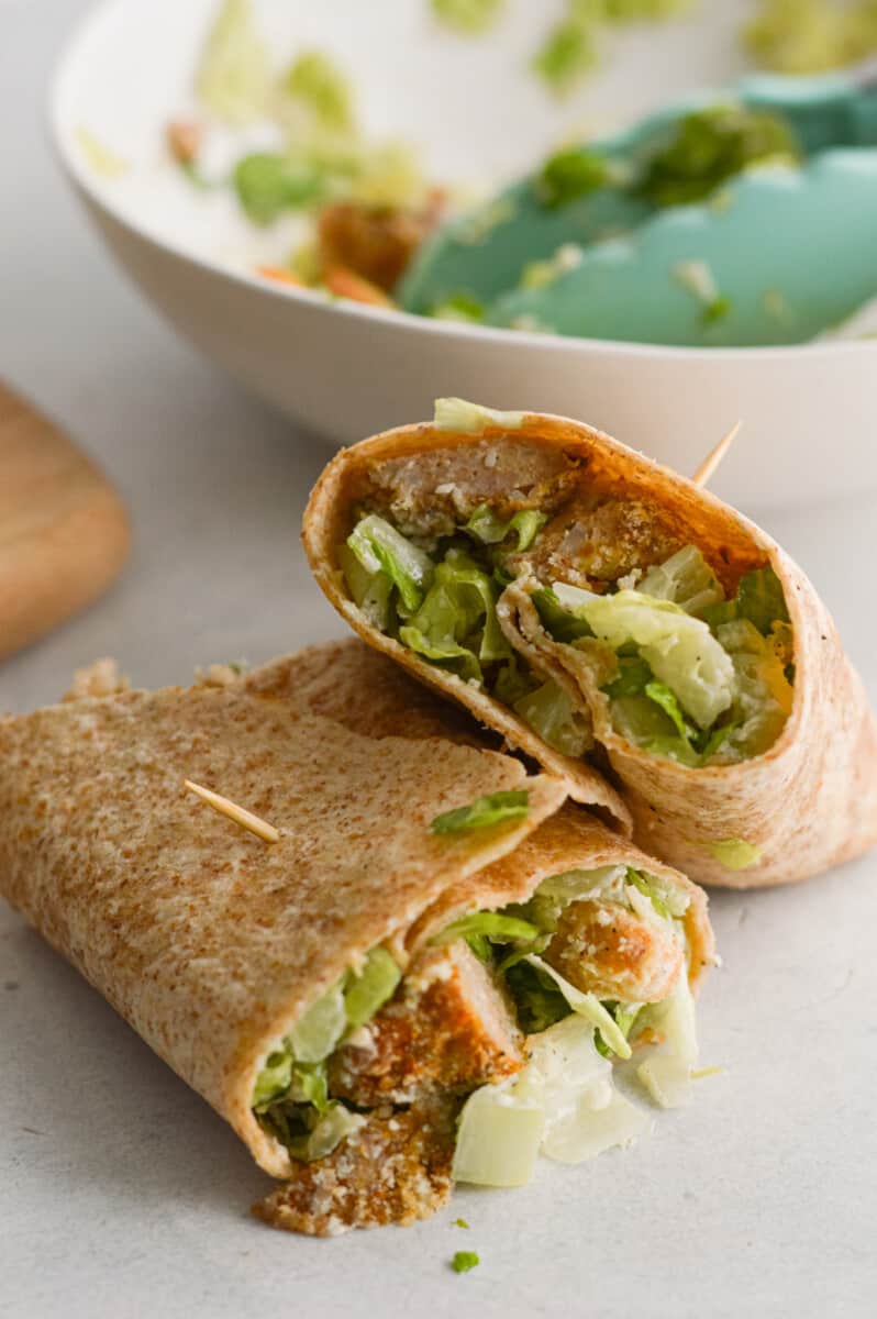 Caesar chicken nugget wrap cut in half.