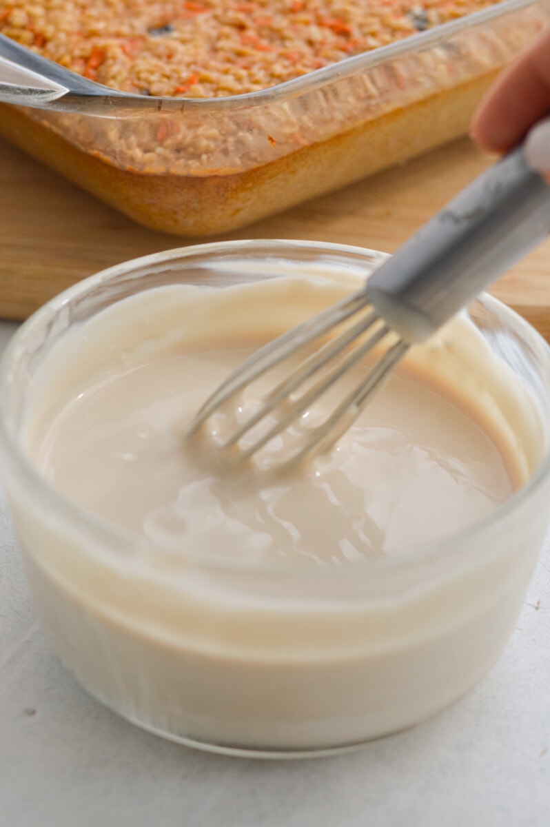 Mixing greek yogurt, cream cheese, honey and vanilla.