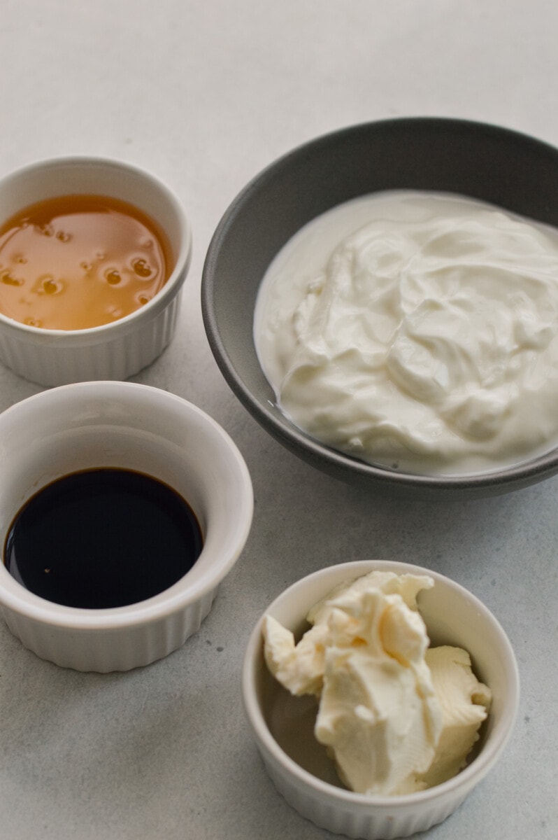 Ingredients measured including greek yogurt, cream cheese, honey and vanilla.