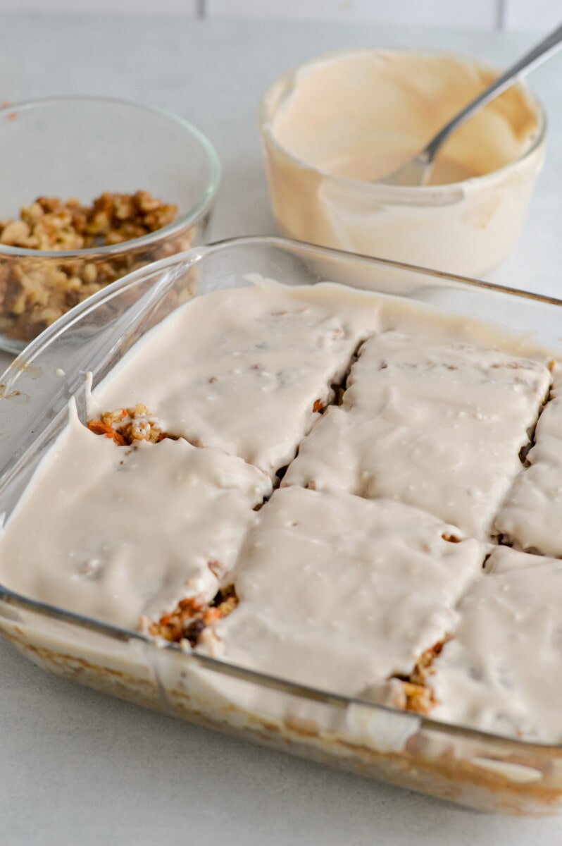 Adding greek yogurt frosting to carrot cake baked oatmeal.