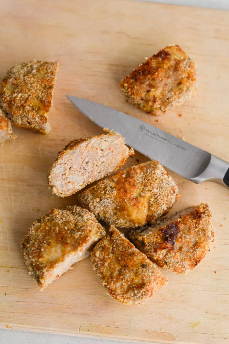 Slicing chicken nuggets in half.