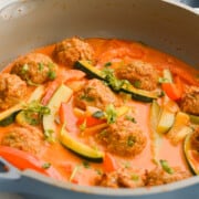 Pan of Thai red meatball curry.