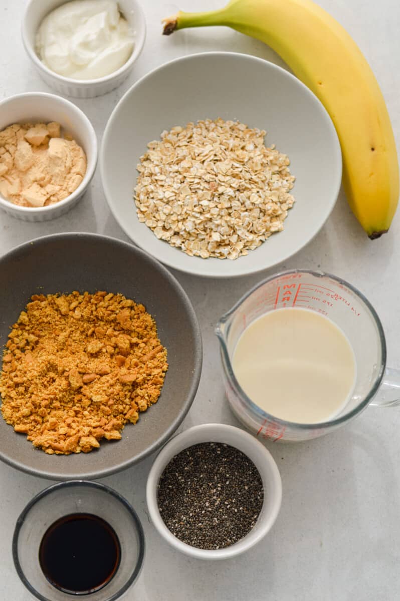 Ingredients including banana, milk, oats, vanilla, protein powder, chia seeds and Greek yogurt.