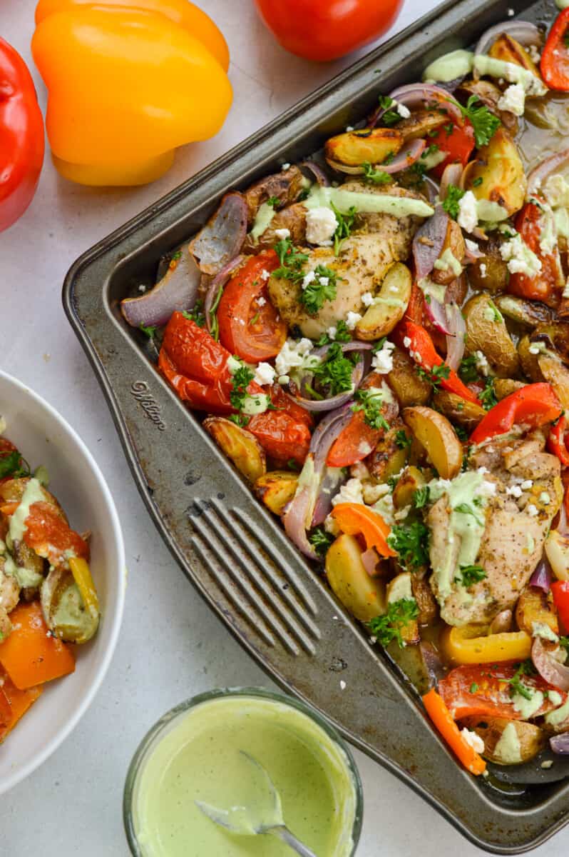Birds eye of sheet pan roasted Greek lemon chicken and peppers., served with herb whipped feta sauce.