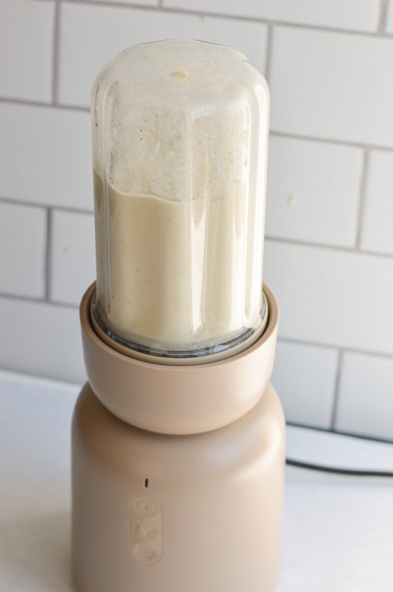 Blending white bean dip.