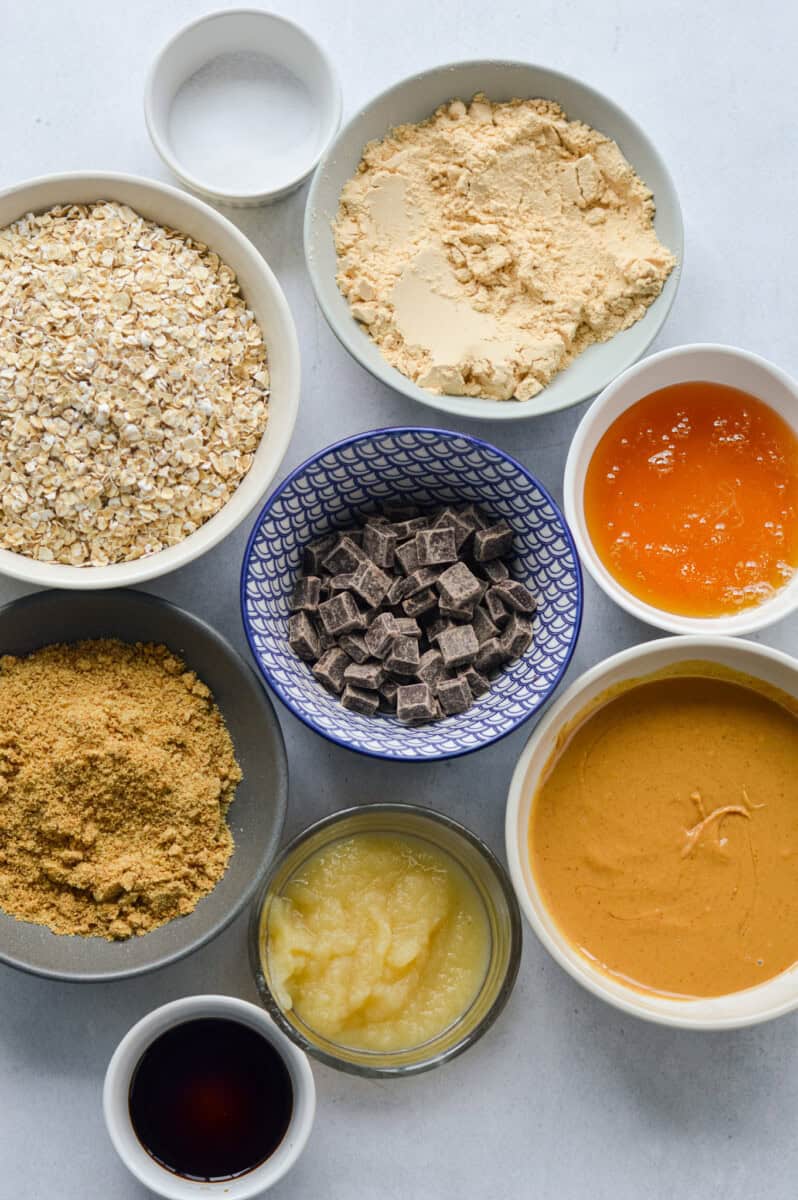 Ingredients including oats, protein powder, chocolate, honey, flaxseed, applesauce, peanut butter and salt.
